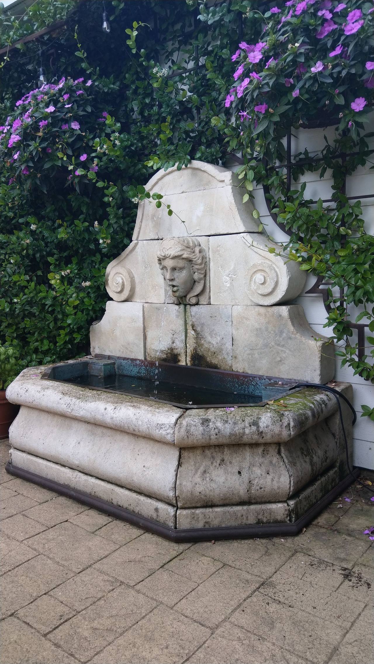 Stone fountain with lotus leaves